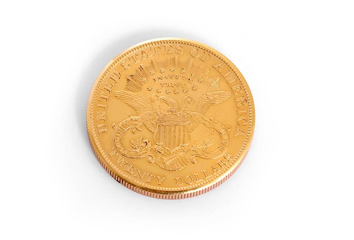 Manual winding. 18k yellow gold  case made from actual $20 gold coin dated 1899. Gold colored dial with black Roman numerals and stick markers. Pre-owned with custom box.