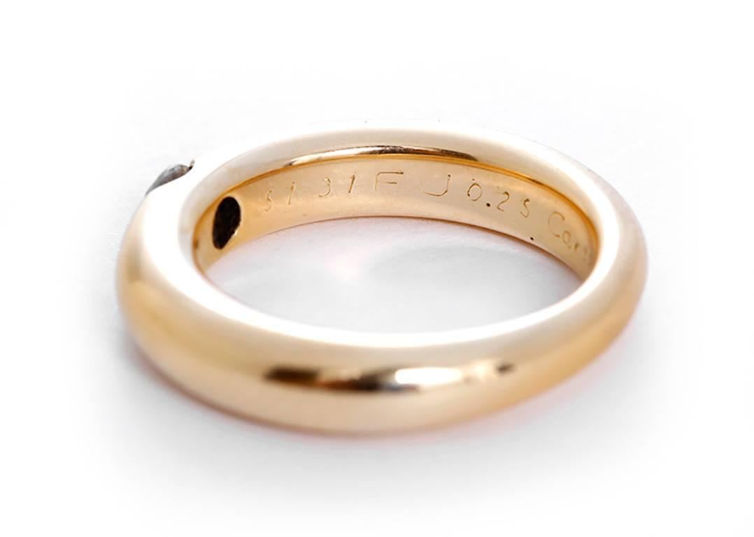 This is a beautiful 18k yellow gold ring a part of The Ellipse collection. It is stamped 51, 31FJ 0.25, 750, Cartier, and 1993. The ring is a size 51(US 5-3/4) with a total weight of 9.0 grams. Cartier box and certificate included.