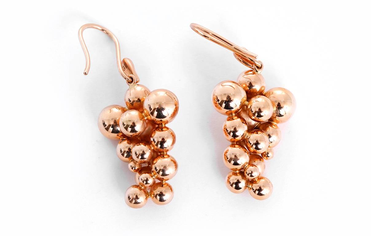 These Georg Jensen "Moonlight Grapes" earrings, each feature diamond melee accents in 18k rose gold. Earring measure apx. 1-1/8 inches in length. Total weight is 9.5 grams.