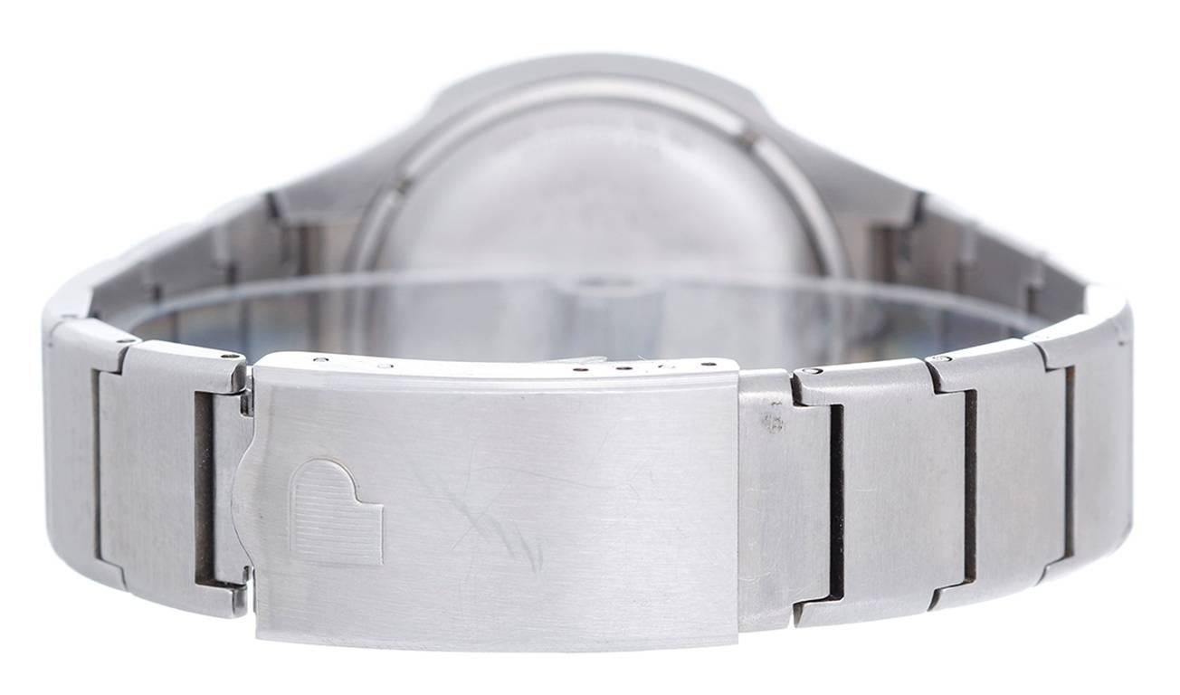 Quartz. Brushed stainless steel case (37mm wide). LED display lights to make date and time visible when buttons above or below it are pressed. Brushed stainless steel bracelet (will fit apx. 6-3/4 in. wrist). Pre-owned.