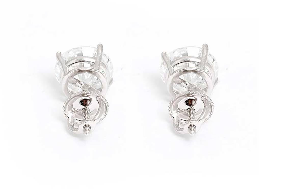 These amazing stud earrings feature 4.26 ctw. of I-J color and SI1-SI2 clarity round brilliant cut diamonds  in 14k white gold. Please see additonal images of UGS (subsidiary of EGL) report. These earrings are perfect for any special occasion or