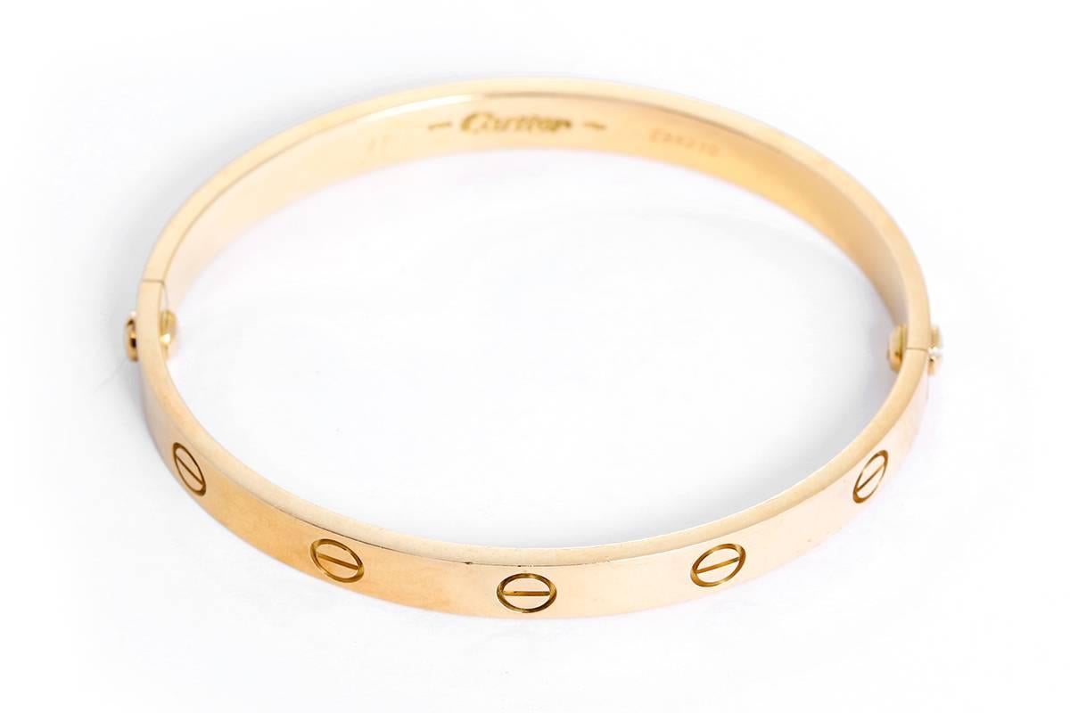 This beautiful bracelet is stamped Cartier, 750, 17,  and E89210.  This is a great piece for everyday as well as dress. Authenticity guaranteed. Like new condition with no dings or scratches. Includes screwdriver. Current Replacement Value: $6,300.00