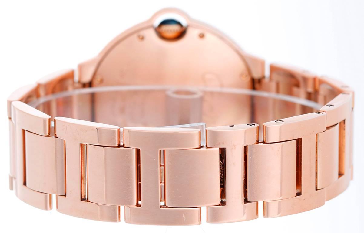 Automatic winding. 18k rose gold case (36mm diameter). 	Silvered guilloche dial with black Roman numerals. Rose gold Cartier bracelet with deployant clasp. Pre- owned box and papers.Retail Price: $27,700.00