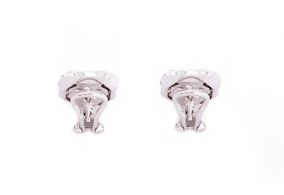 These Damiani Checkmate earrings feature 0.90 cts of diamonds in white gold. Total weight is 14.0 grams. Earrings apx. 9/16-inch in width and apx. 11/16-inch in length. Signed, Damiani.