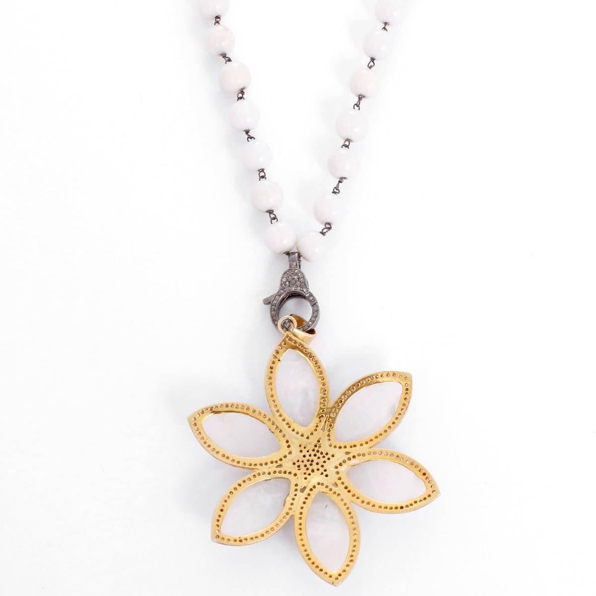  This amazing necklace features a starburst pendant with moonstone and 2.2 carats of diamonds set in silver plated gold with a diamond clasp in oxidized silver on a white agate bead chain. Pendant including clasp measures apx. 3-1/2 inches in length