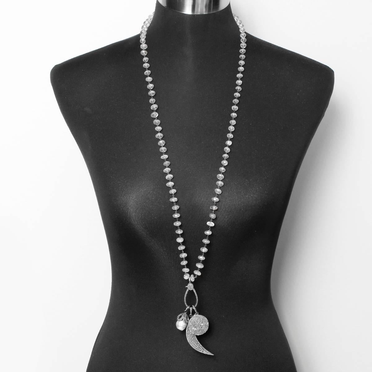 This bohemian inspired necklace features a pearl, moon, and disc pendant with 4.24 ctw. of diamonds set in oxidized silver on a clasp with a clear quartz chain. Pendant and clasp measures apx. 4-1/4 inches in length at the longest point. Chain