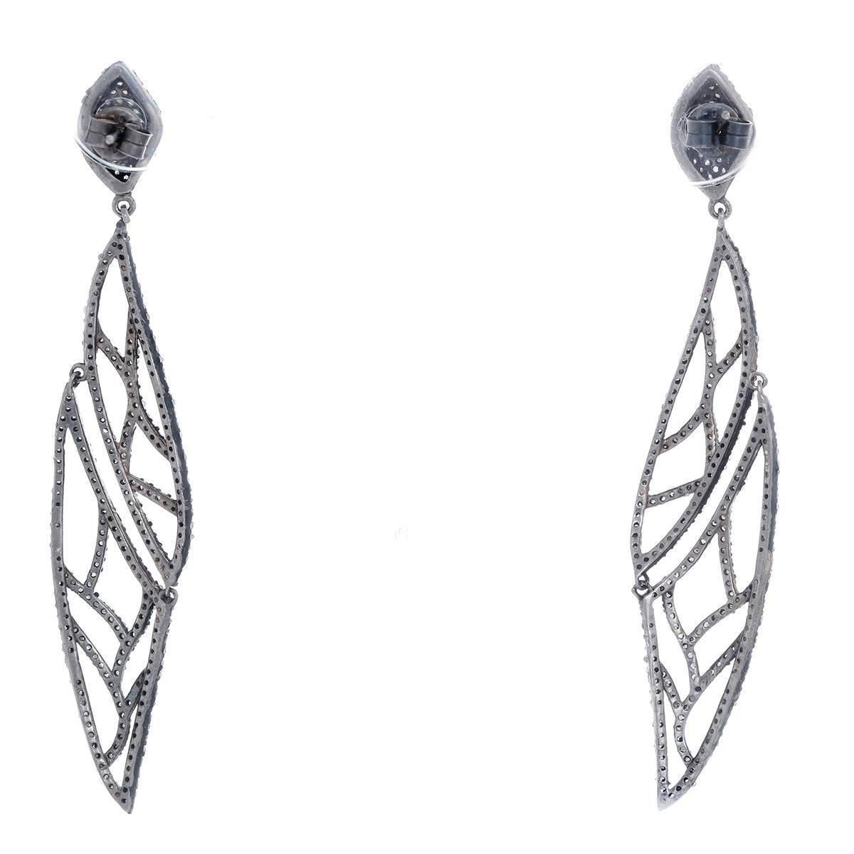 These amazing earrings feature 1.9 ctw. of diamond set in oxidized silver.  Earrings measure apx. 3-3/8 inches in length. Total weight is 11.9 grams.