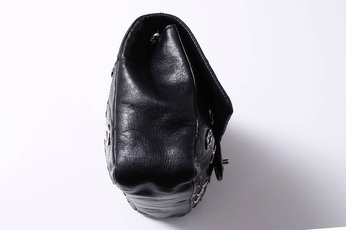 Rare and limited Edition Chanel Lucky Charm leather shoulder handbag on a chain with silver, black, and gold tone hardware and Swarovski crystals. Has a few missing crystals on back; however does not detract from overall piece. The interior is lined
