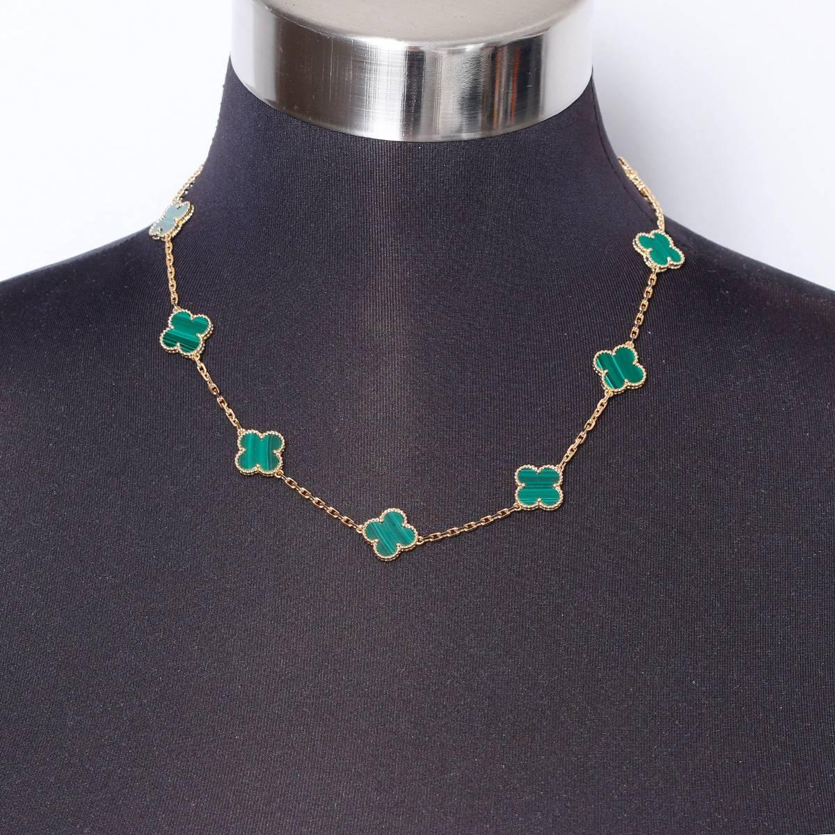 This Van Cleef & Arpels necklace is a part of the Vintage Alhambra Collection. It features 10 malachite iconic motifs in 18k yellow  gold. It is stamped VCA, AU750, JE606179. It measures apx. 16-1/2 inches in length and weighs 28.4 grams.Van Cleef