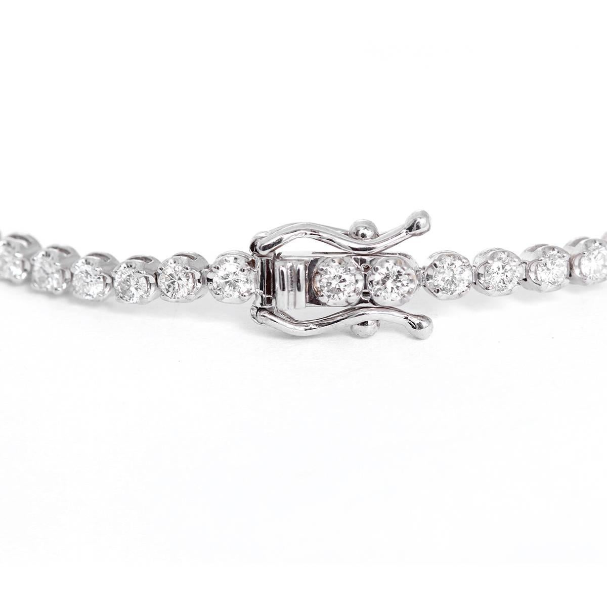 This stunning tennis bracelet features 2.07 carats of SI-SI2 clarity and HI-color diamonds set in 14k white gold. Bracelet measures apx. 7-inches in length. Total weight is 5.5 grams.