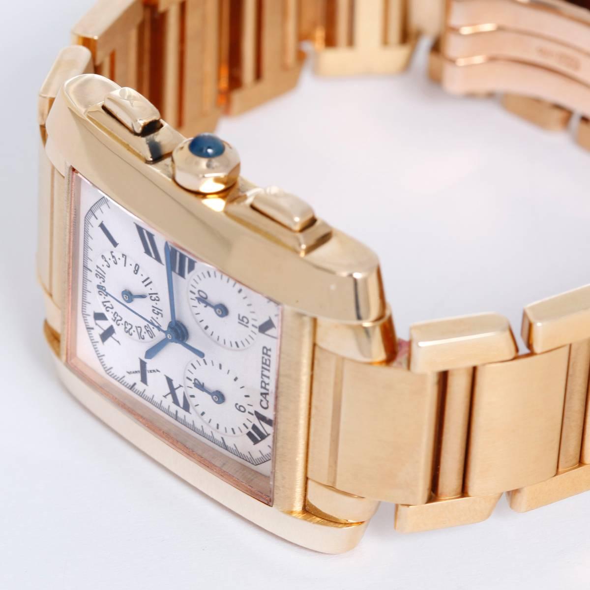 Quartz. 18k yellow gold rectangular style case (28mm x 32mm). White dial with black Roman numerals. 18k yellow gold Cartier bracelet. Pre-owned with Cartier box. W5000R2   Retail Price: $26,400.00