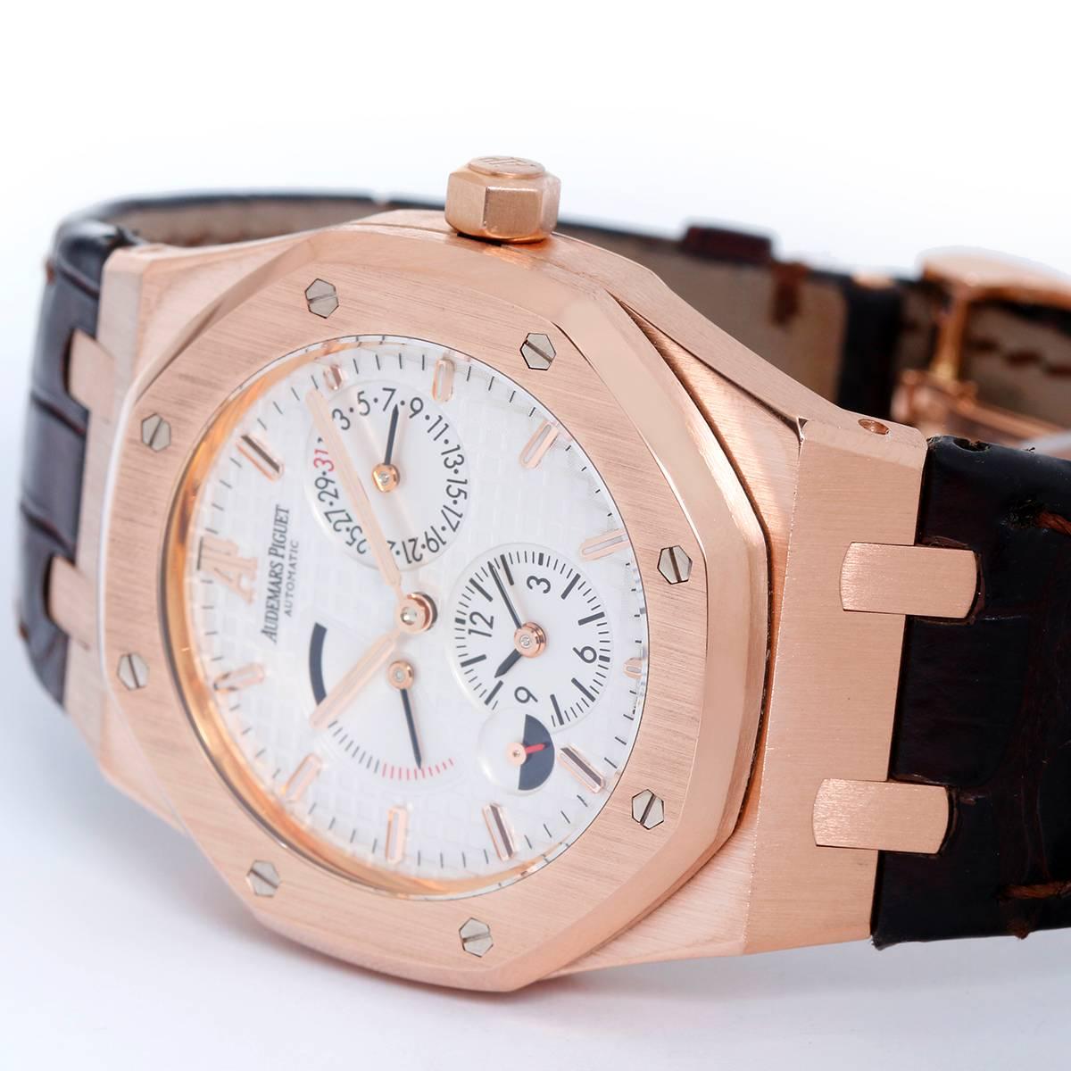 Audemars Piguet Royal Oak Dual Time Rose Gold Watch -  Automatic; 33 Jewels. 18K Rose Gold; 39mm X 49mm including lugs. Metalic silvered dial with an engrave tapestry "waffle" design; Dual/Second Time zone sub-dial located at the 6 o'clock