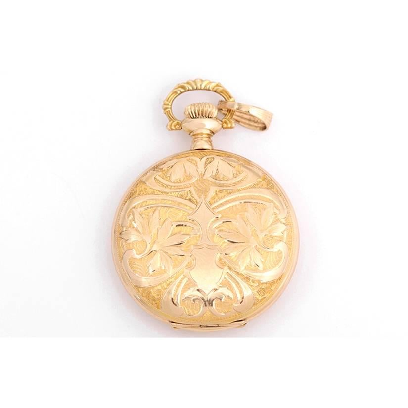 Vintage Waltham 14k Yellow Gold Ladies Pendant Watch -  Manual winding. 14k yellow gold case ornately engraved both front and back (34mm diameter). Enamel dial with subseconds dial. Black Arabic numerals. Pre-owned vintage pendant watch very popular