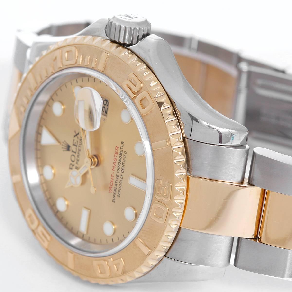 Rolex Yacht-Master Steel & Gold Men's 2-Tone Sport Watch 16623 -  Automatic winding, 31 jewels, Quickset, sapphire crystal. Stainless steel case with 18k yellow gold bezel  (40mm diameter). Champagne dial with luminous markers. Stainless steel and