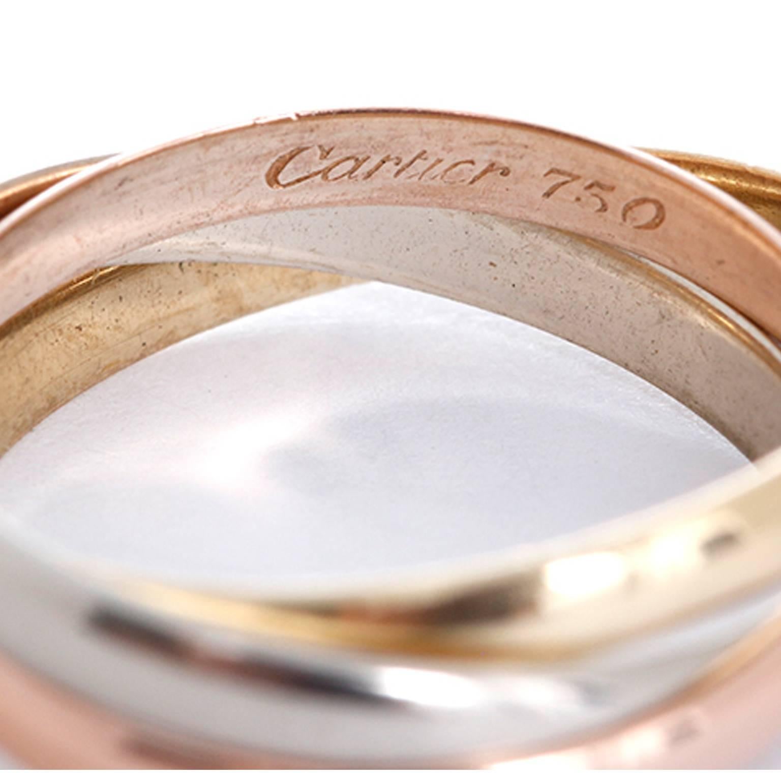 Cartier Trinity 18K Tri-Color Ring Sz. 51(US 5-3/4) -  This Cartier Trinity ring features 18k white, yellow, and pink gold. Three symbolic colors: pink for love, yellow for fidelity and white for friendship. Small model; total weight is 3.9 grams.