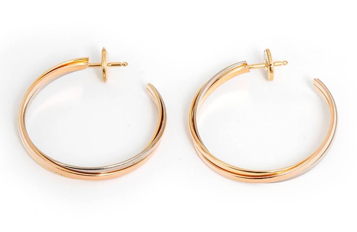 Cartier Trinity Tri-Color Hoop Earrings - These Cartier earrings feature 18k white, yellow, and pink gold bands. Three symbolic colors: pink for love, yellow for fidelity and white for friendship. Earrings are  stamped Cartier, 750, DC 3433. Total