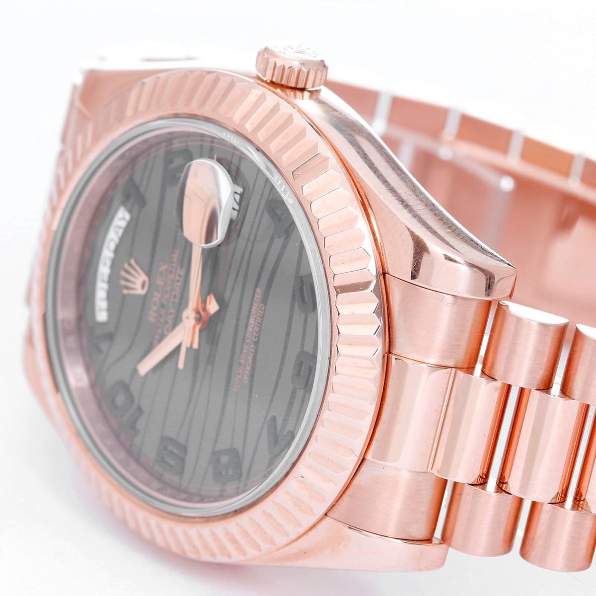 Rolex President Day-Date II Men's 18k Rose Gold Watch 218235 -  Automatic winding; quick-set; sapphire crystal. 18k rose gold case with fluted bezel (41mm diameter). Wave dial with black arabic  numerals. 18k rose gold hidden-clasp President