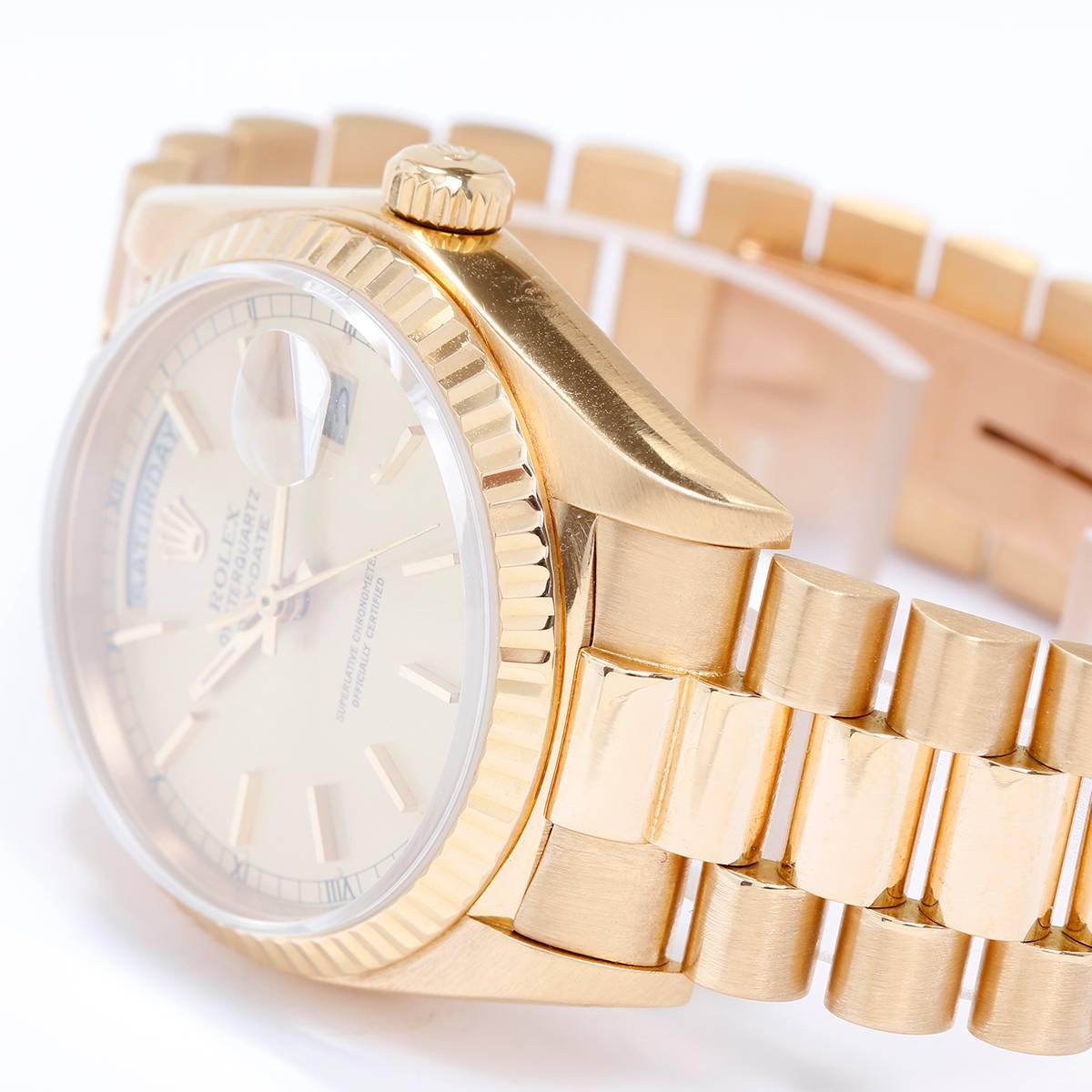 Men's Gold Day-Date Rolex President Watch 18038 -  Automatic winding; quick-set; sapphire crystal. 18k yellow gold case with fluted bezel (36mm diameter). Champagne dial with gold stick markers. 18k yellow gold President bracelet. Pre-owned with