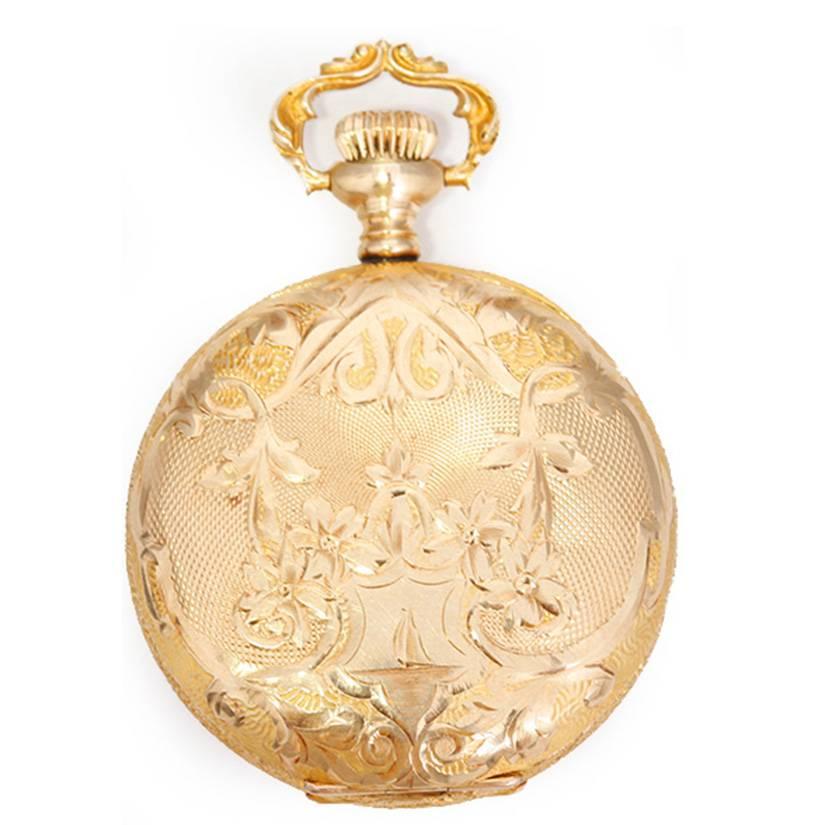 Elgin 14k Sold Gold Ornately Engraved Ladies Antique Pocket Watch -  Manual winding. 14k solid gold engraved case (34mm diameter). Enamel dial with black Arabic numerals; sub-seconds at 6 o'clock. Pre-owned, ca. early 1900's.