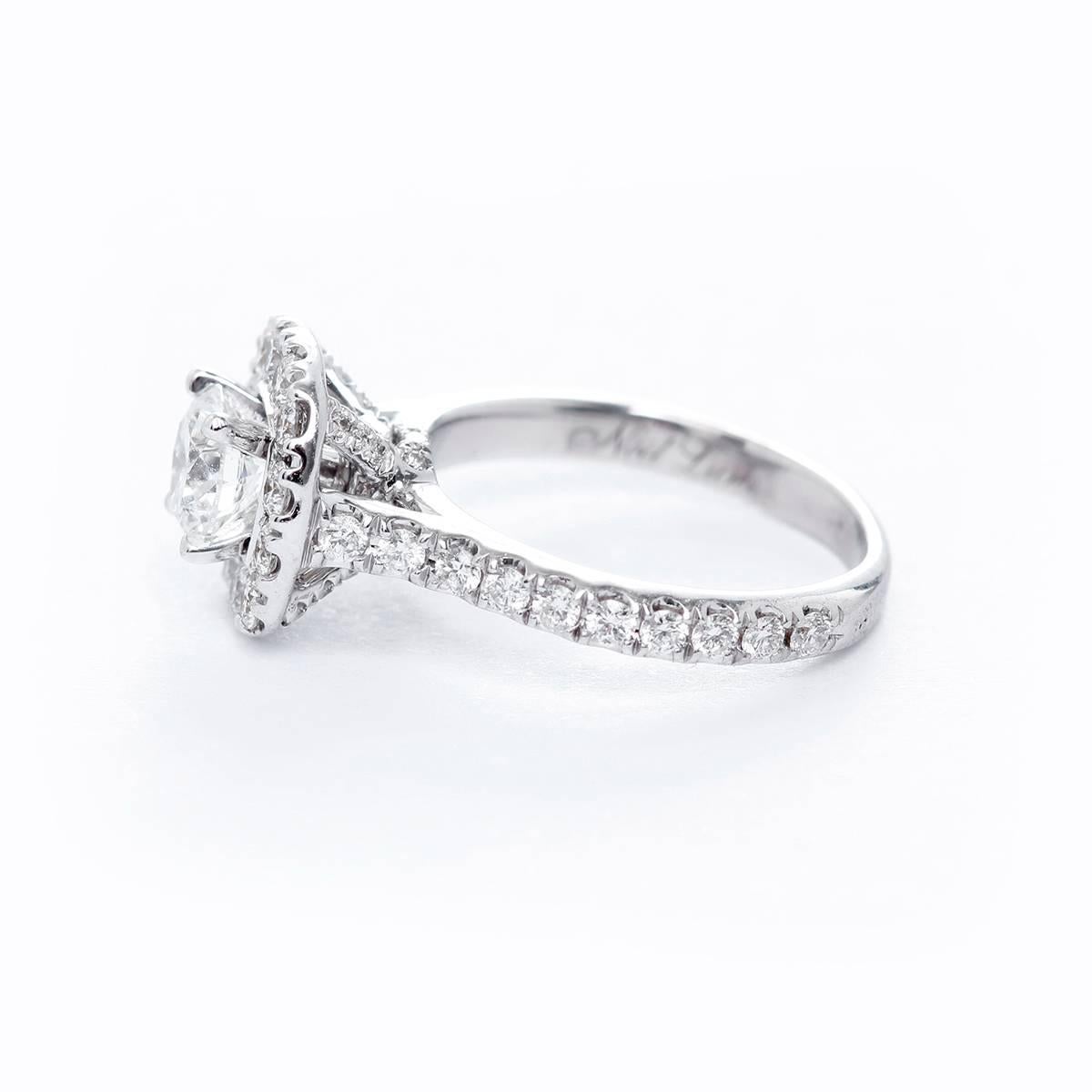Neil Lane Bridal Collection 14k White Gold Round Diamond Sz 5 - . Classic yet luxurious engagement ring from Neil Lane is crafter in 14k White Gold. With a Center stone of .69ct, bordered with a halo frame of smaller sccent diamonds. Neil Lane's