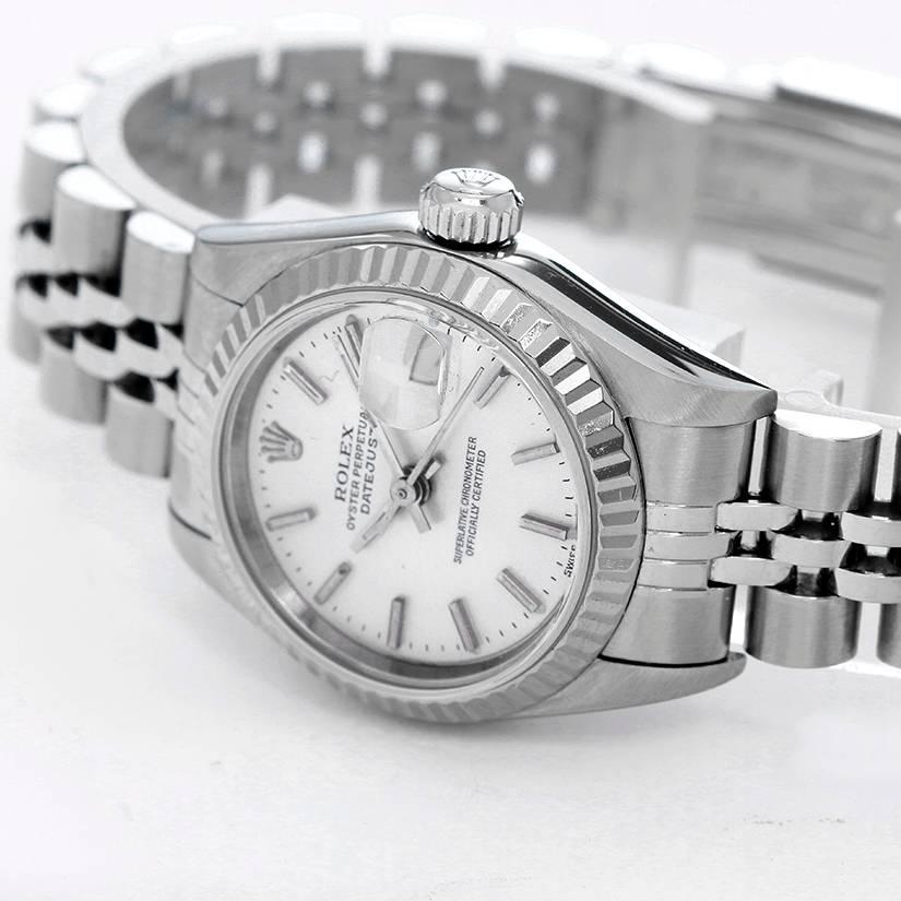 Rolex Datejust Stainless Steel Ladies Watch 69174 -   Automatic winding. Stainless steel case with 18k white gold Fluted bezel (26mm diameter). Silvered dial with stick markers. Stainless steel Jubilee bracelet. Pre-owned with custom box.
