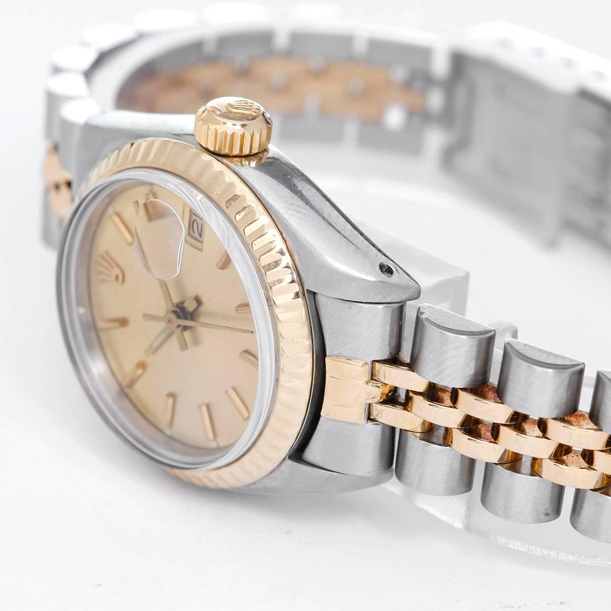 Ladies Rolex Date 2-Tone Watch 6917 -  Automatic winding, 29 jewels, date, acrylic crystal. Stainless steel case with 18k yellow gold fluted bezel (26mm diameter). Silvered dial with stick markers. Stainless steel and 18k yellow gold Jubilee