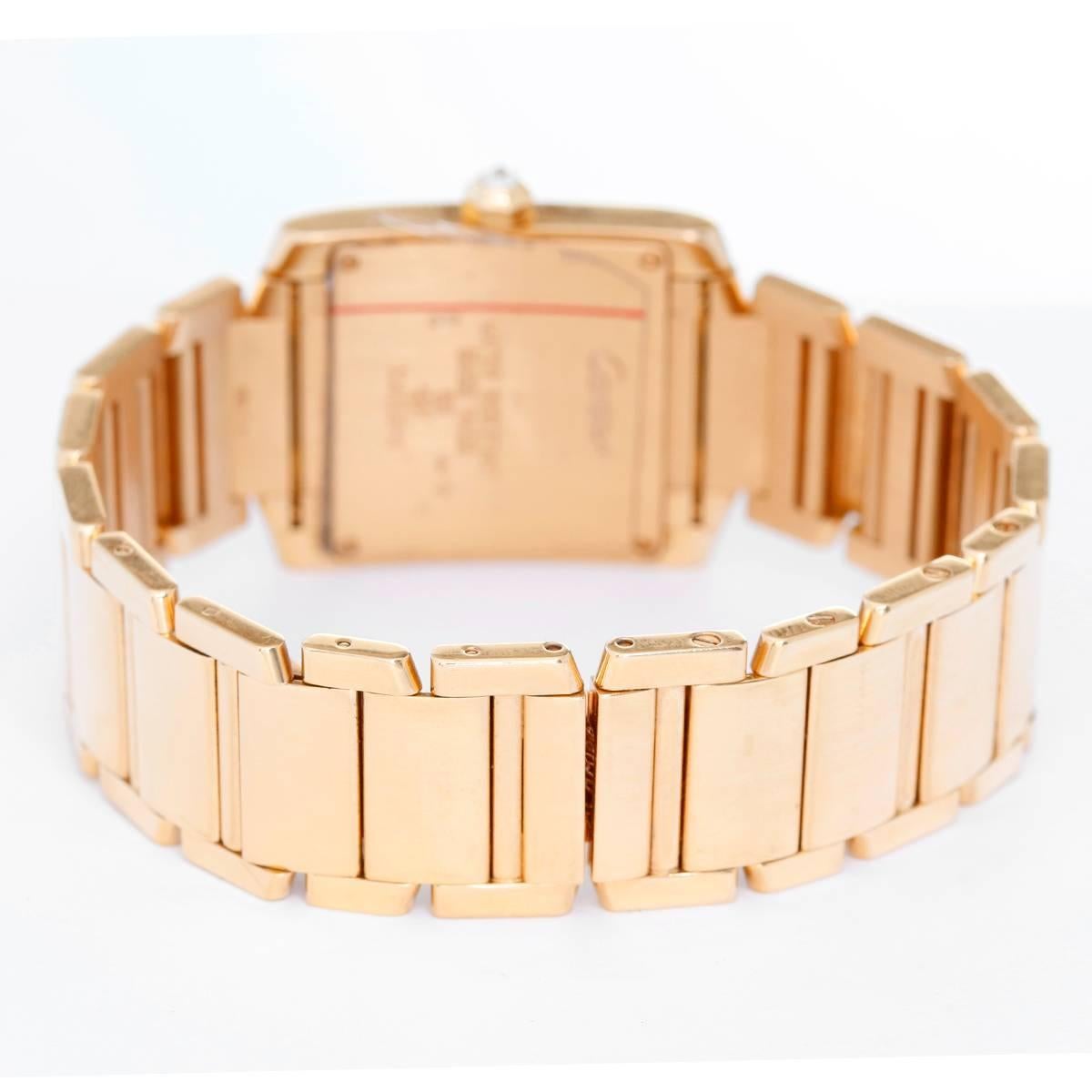 Cartier Tank Francaise Midsize 18k Yellow Gold Watch WE1017R8 - Quartz. 18k yellow gold case with 2 rows of diamonds on either side (25mm x 30mm). Ivory colored dial with black Roman numerals. 18k yellow gold Cartier bracelet with deployant clasp.