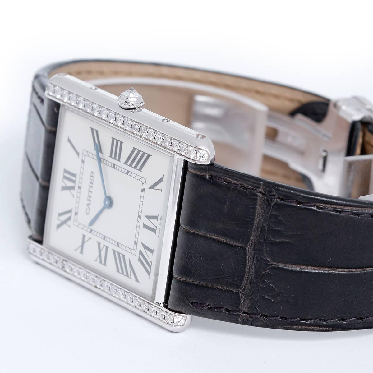 Cartier Tank Louis 18k White Gold Men's/Ladies Watch WT2000006 -  Manual wind. 18k white gold case with Cartier diamond bezel. (40mm). Silvered dial with black Roman numerals. Chocolate strap with 18k white gold Cartier deployant clasp. Unused with