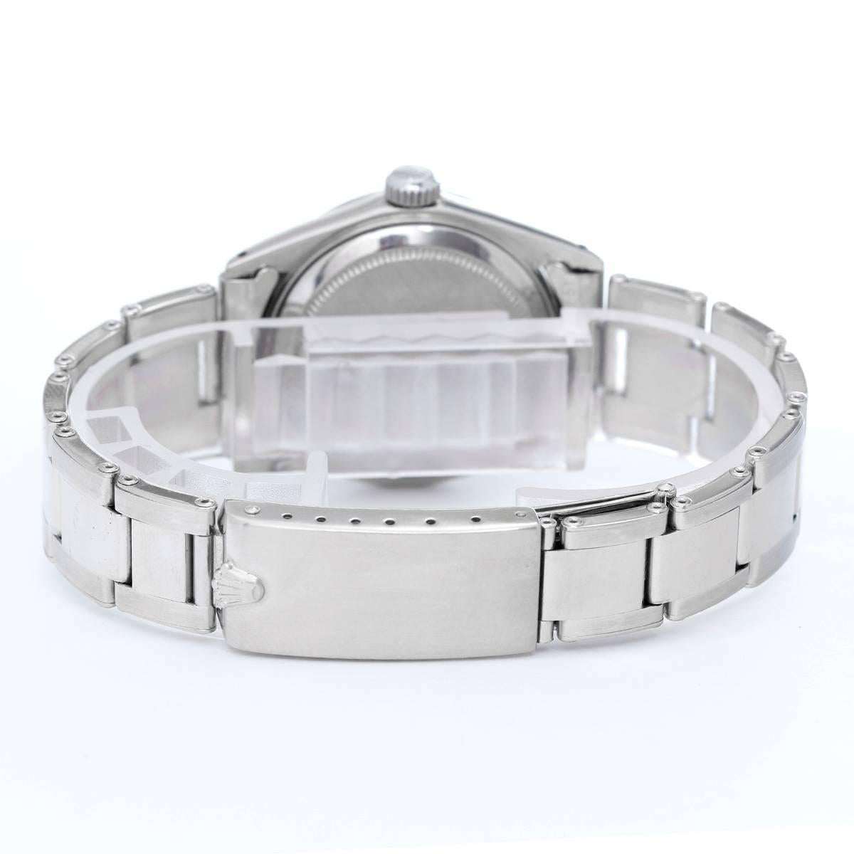 Rolex Datejust Midsize Men's or Ladies Steel Watch 6824 -  Automatic winding, acrylic crystal. 18k White gold case with fluted bezel (31mm diameter). Silvered dial with stick markers. 18k white gold riveted style Oyster bracelet. Pre-owned with