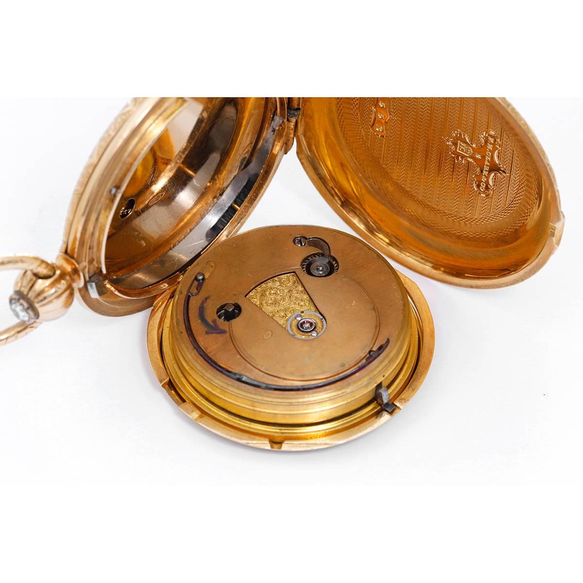 F. H. Clark & Co. 18K Yellow Gold Pocket Watch -  Key winding. 18K Yellow Gold Hunting case (56mm) with geometrical engraving.. White enamel dial with Roman numerals; Sub seconds at 6:00 o' clock. Pre-owned with box. The front of the Hunting case