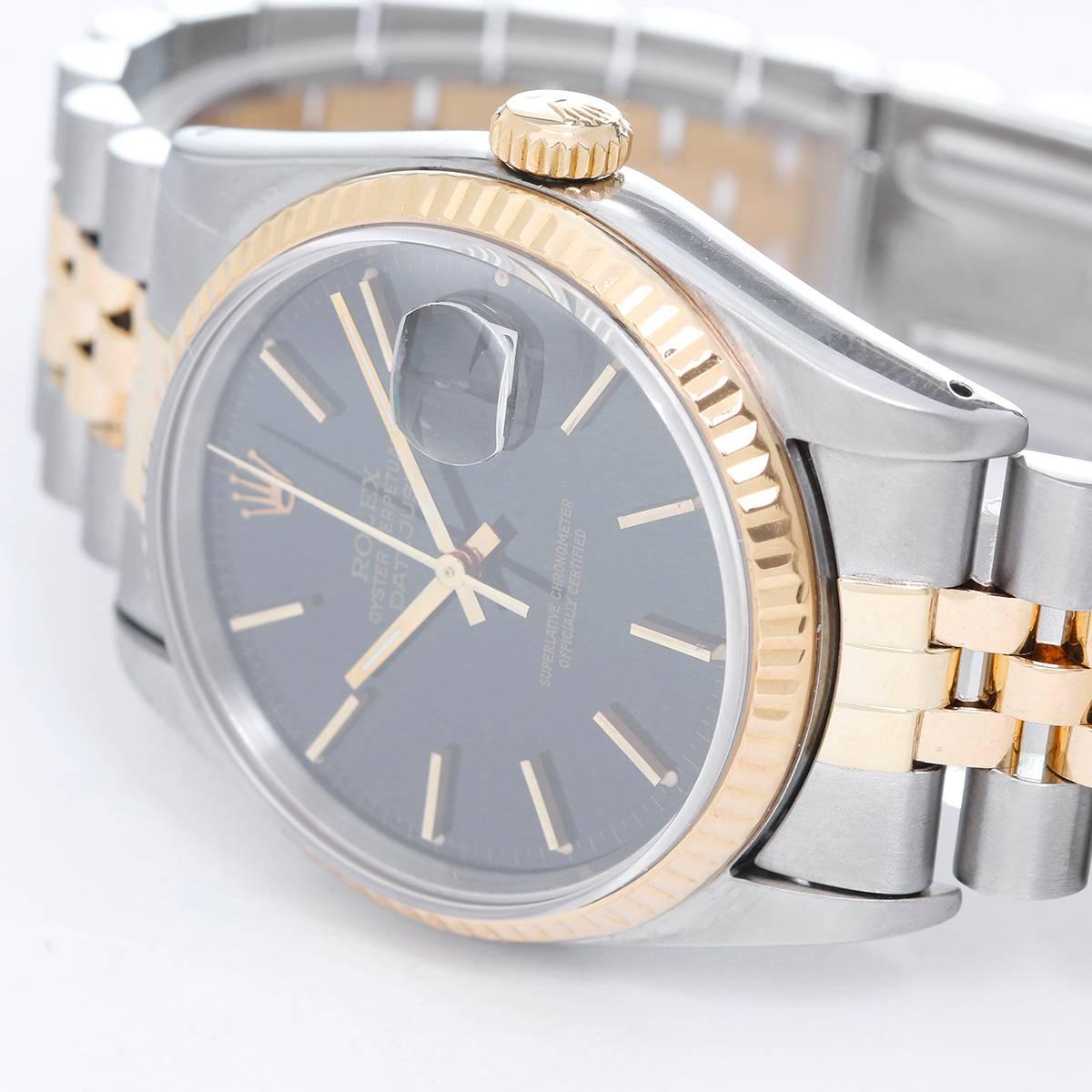 Rolex Datejust Men's 2-Tone Watch 16233 -  Automatic winding, 31 jewels, Quickset, sapphire crystal. Stainless steel with 18k yellow gold fluted bezel  (36mm diameter). Black dial with stick markers. Stainless steel and 18k yellow gold Jubilee