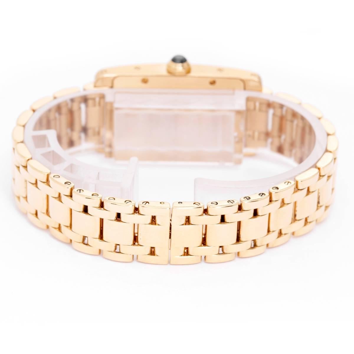 Cartier Tank Americaine Ladies 18k Yellow Gold Watch -  . 18k yellow gold case (19mm x 35mm). Ivory colored dial with black Roman numerals. 18K yellow gold Cartier bracelet will accommodate up to a 6.5 inch wrist. Pre-owned with box.