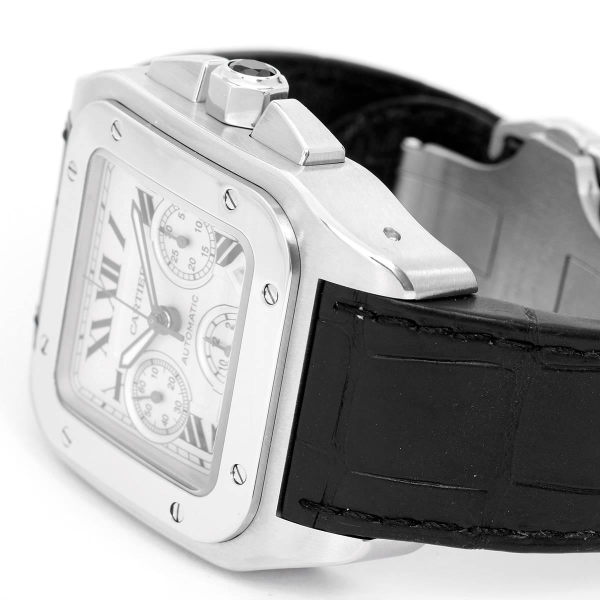 Cartier Santos 100 XL  Chronograph Men's Watch 2740 -   Automatic winding chronograph with date. Stainless Steel case (45mm x 40mm). Silvered chronograph dial with Roman numerals. Cartier Black leather strap band with stainless steel double fold