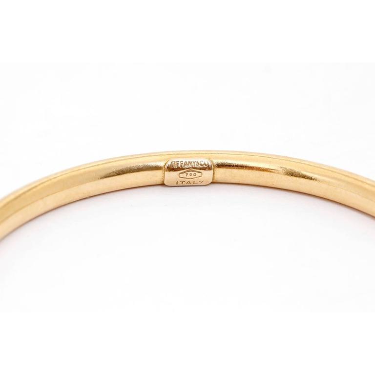 Tiffany and Co. Yellow Gold Hinged Oval Bangle Bracelet at 1stDibs