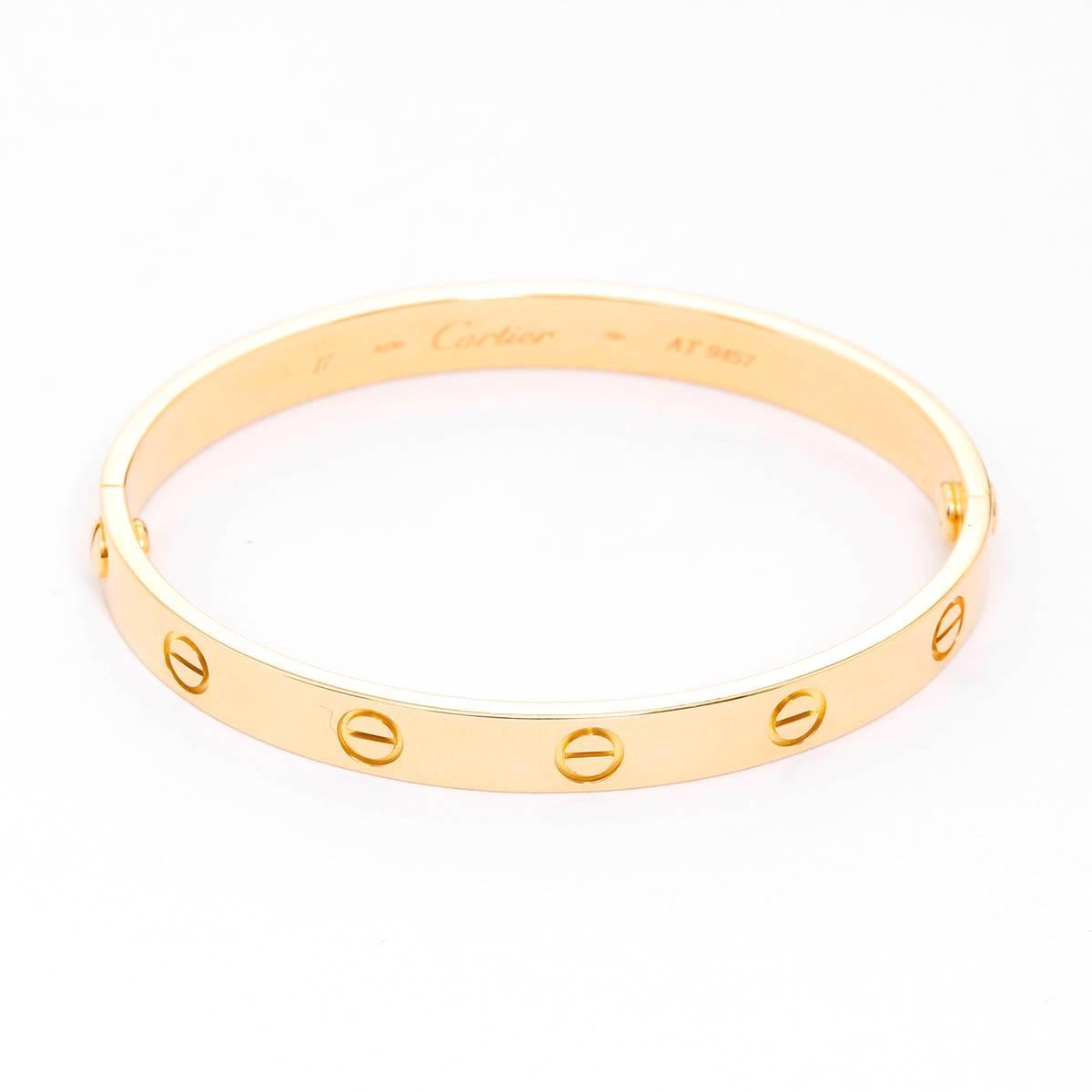 Cartier Love Bracelet 18k Yellow Gold Size 17 with Screwdriver - . This beautiful bracelet is stamped Cartier, 18, 750  and AT9457.  This is a great piece for everyday as well as dress. Authenticity guaranteed. Like new condition with no dings or