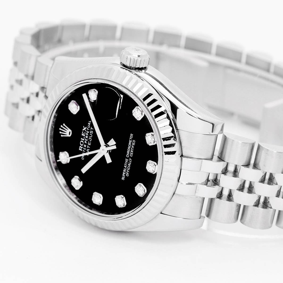 Rolex Datejust Midsize Men's/Ladies Steel Watch 178274 -  Automatic winding; 31 jewel; sapphire crystal. Stainless steel case with 18k white gold fluted bezel (31mm diameter). Factory black diamond dial. Stainless steel Jubilee bracelet. Pre-owned