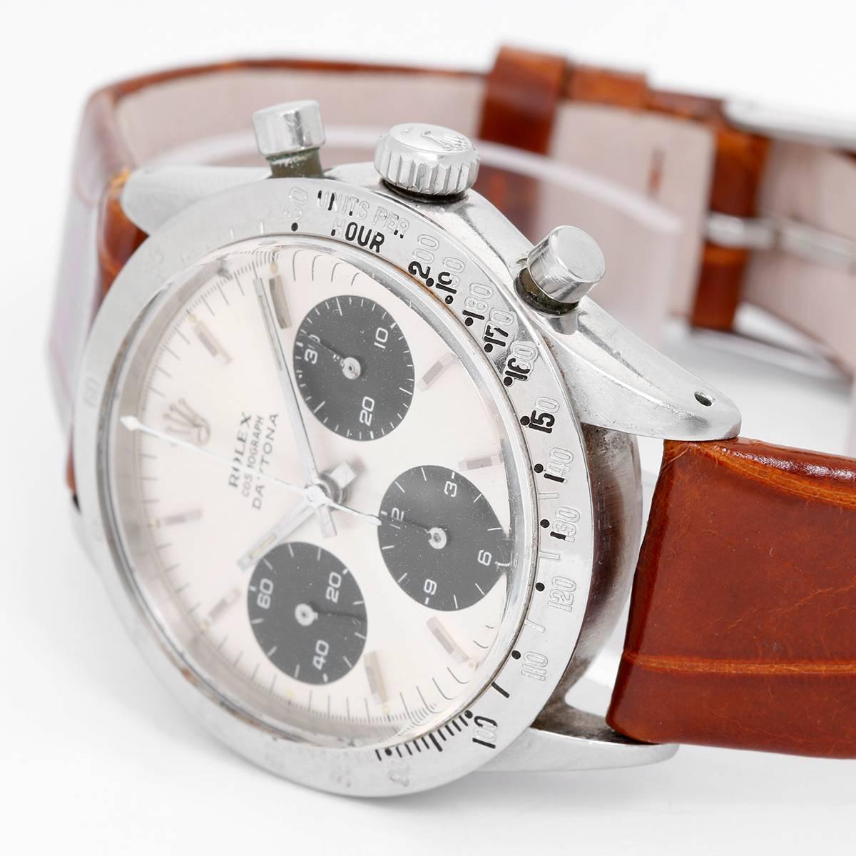 Rolex Stainless Steel Daytona Ref 6262 Men's Watch -  Automatic. Stainless Steel ( 36.5 mm ). White dial with black registered dials. Brown croc strap with buckle. Pre-owned with box. One of rarest vintage Rolex watches ever made. Only produced in