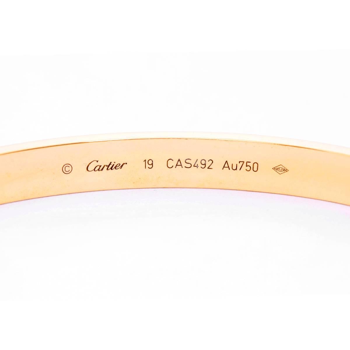 Cartier Love Bracelet 18k Yellow Gold Size 19 with Screwdriver - . This beautiful bracelet is stamped Cartier, 19, 750  and  CAS492.  This is a great piece for everyday as well as dress. Authenticity guaranteed. Like new condition with no dings or