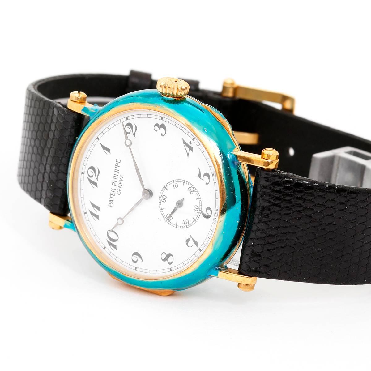 Patek Philippe 150th Anniversary Officers Watch 18k Yellow Gold with Hinged Back 3960 (or 3960J) - Manual winding. 18k yellow gold case with hinged back cover that opens to view display back with sapphire crystal (33mm diameter). White dial with