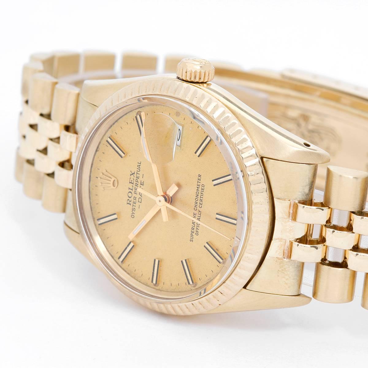 Rolex Date Men's 14k Yellow Gold Watch -  Automatic winding. 14k yellow gold (34mm diameter). Champagne dial with  stick markers. 14k Jubilee  Yellow gold bracelet. Pre-owned with box.