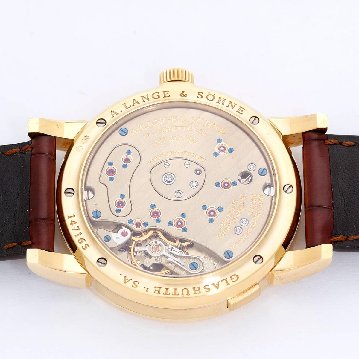 A. Lange & Sohne Grande Lange 1 Yellow Gold Men's Power Reserve Big Date Watch 101.022 -  Manual winding. Yellow gold case with exposition back (39mm diameter). Silver dial with offset time dial with Roman numerals; sub seconds, power reserve