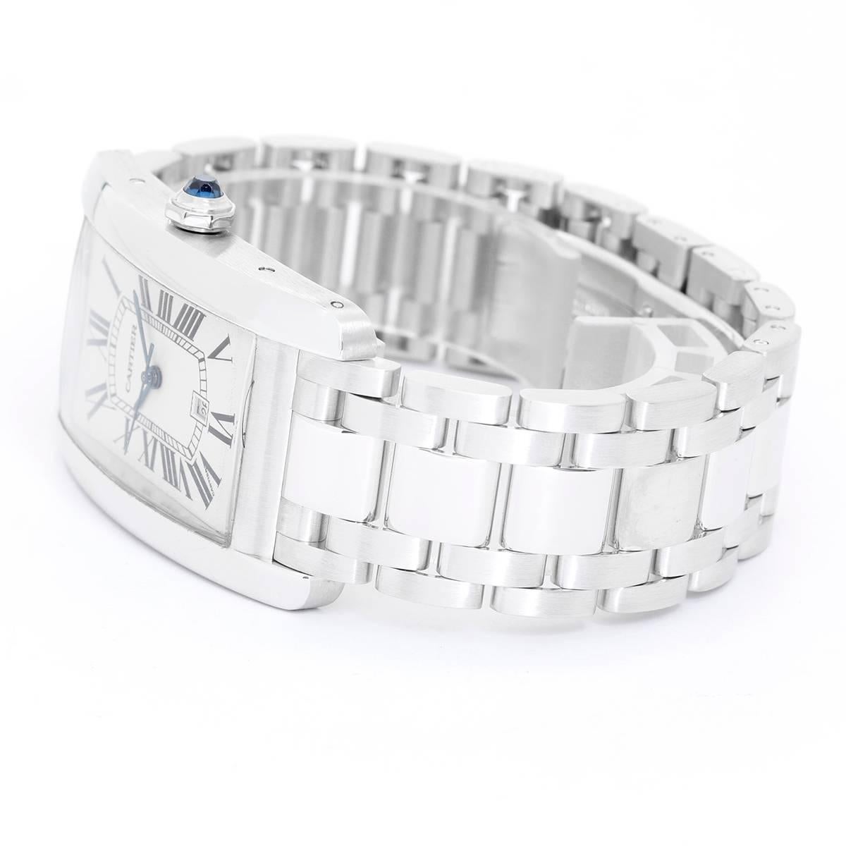 Cartier Tank Americaine 18K White Gold W26055L1 -  Automatic winding. 18K White Gold ( 26 x 44 mm ). Silvered guilloche dial with black Roman numerals; Date at 6:00 o' clock. 18K White Gold Cartier bracelet with deployant clasp. Pre-owned with