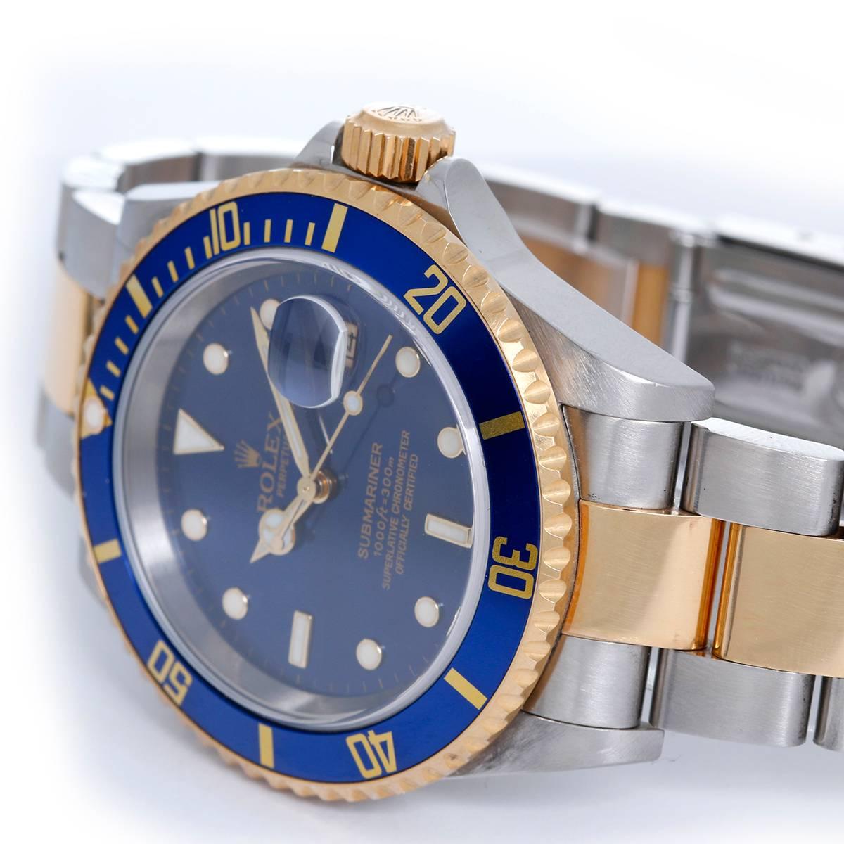 Rolex SubmarinSer 2-Tone  Steel & Gold Men's Watch 16613 Blue Dial -  Automatic winding, 31 jewels. Stainless steel case with 18k yellow gold bezel with blue insert (40mm diameter). Blue dial with luminous style markers; date at 3 o'clock. Stainless