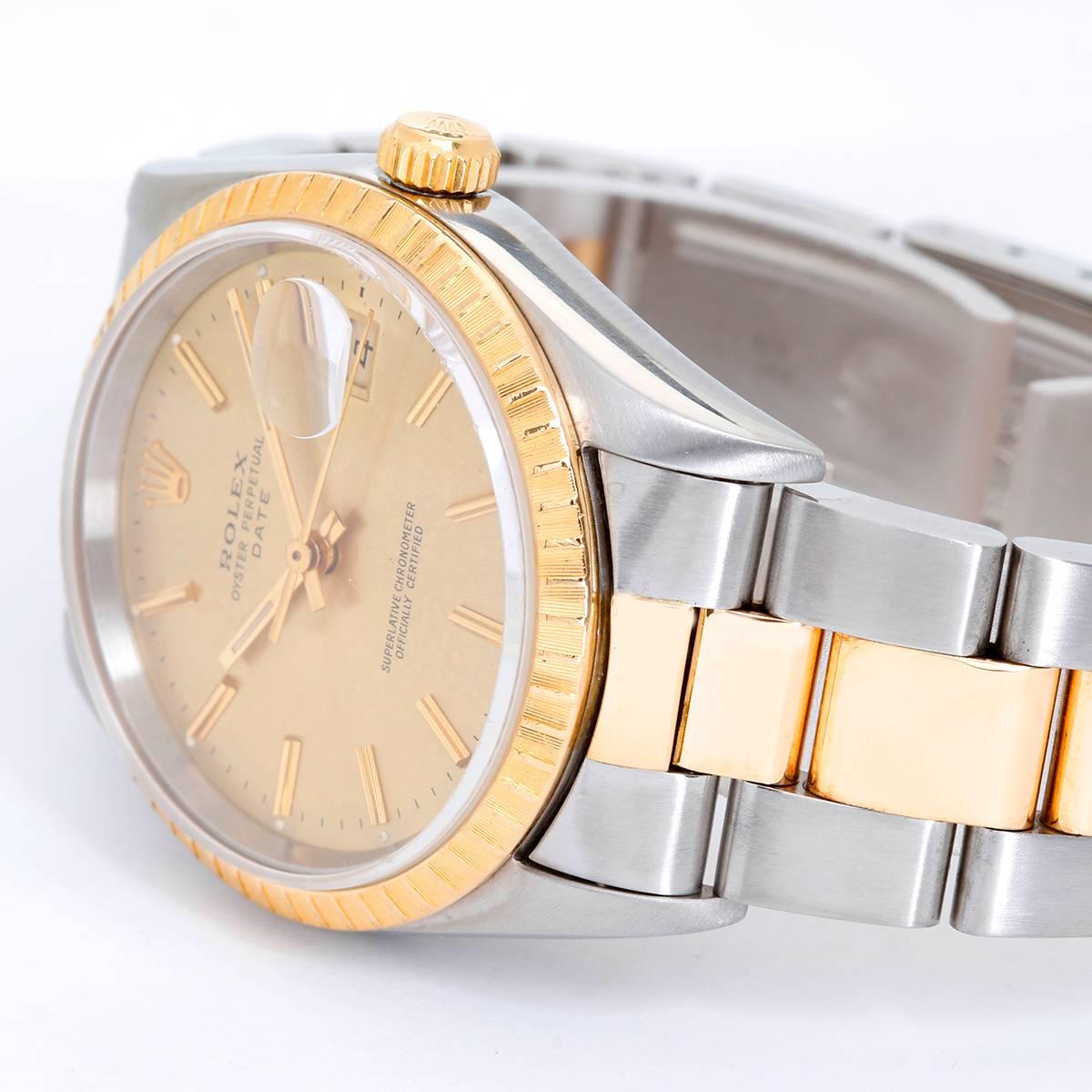 Rolex Date Men's 2-Tone Steel & Gold Watch 15223 -  Automatic winding, 31 jewels, Quickset, sapphire crystal. Stainless steel case with gold engine turned bezel (34mm diameter). Champagne dial with stick markers. Stainless steel and 18k yellow