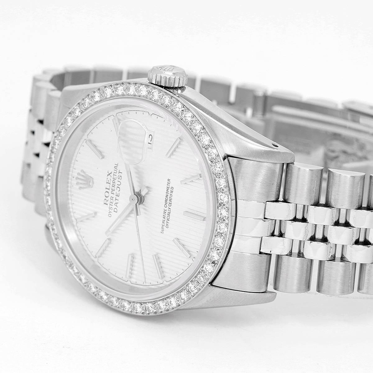 Rolex Datejust Stainless Steel 16220 Mens Watch -  Automatic Winding. Stainless Steel case with custom diamond bezel (35mm ). Silvered Tapestry Dial with raised hour markers. Stainless Steel Jubilee bracelet. Pre-owned with box.
