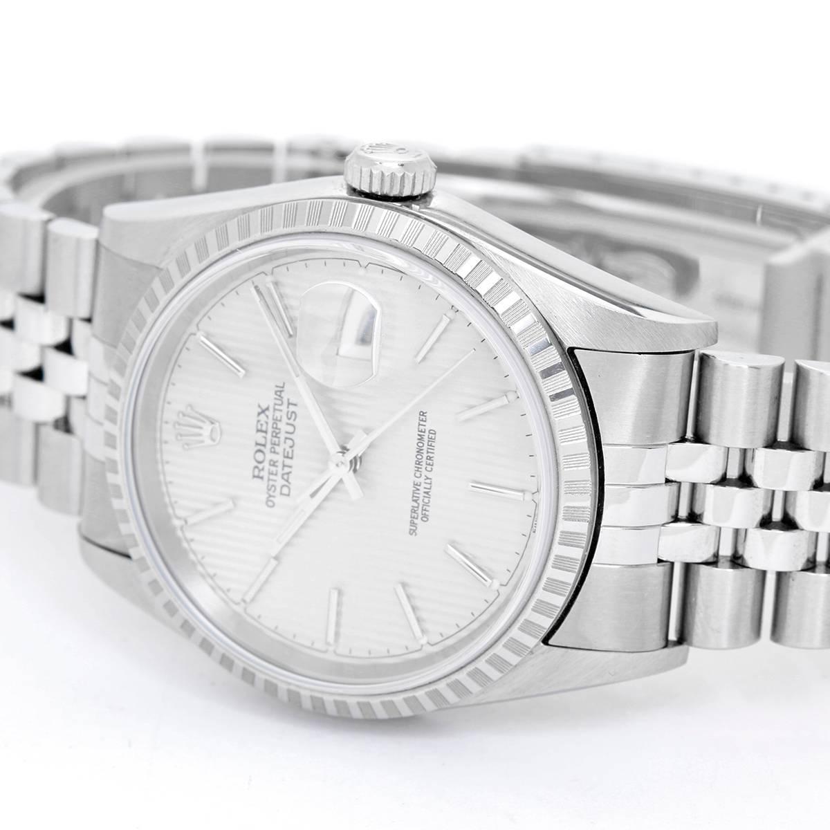 Rolex Datejust Men's Stainless Steel Watch 16220 -  Automatic winding, 31 jewels, Quickset, sapphire crystal. Stainless steel case with engine turned bezel (36mm diameter). Silver tapestry dial with stick markers. Stainless steel  Jubilee bracelet.