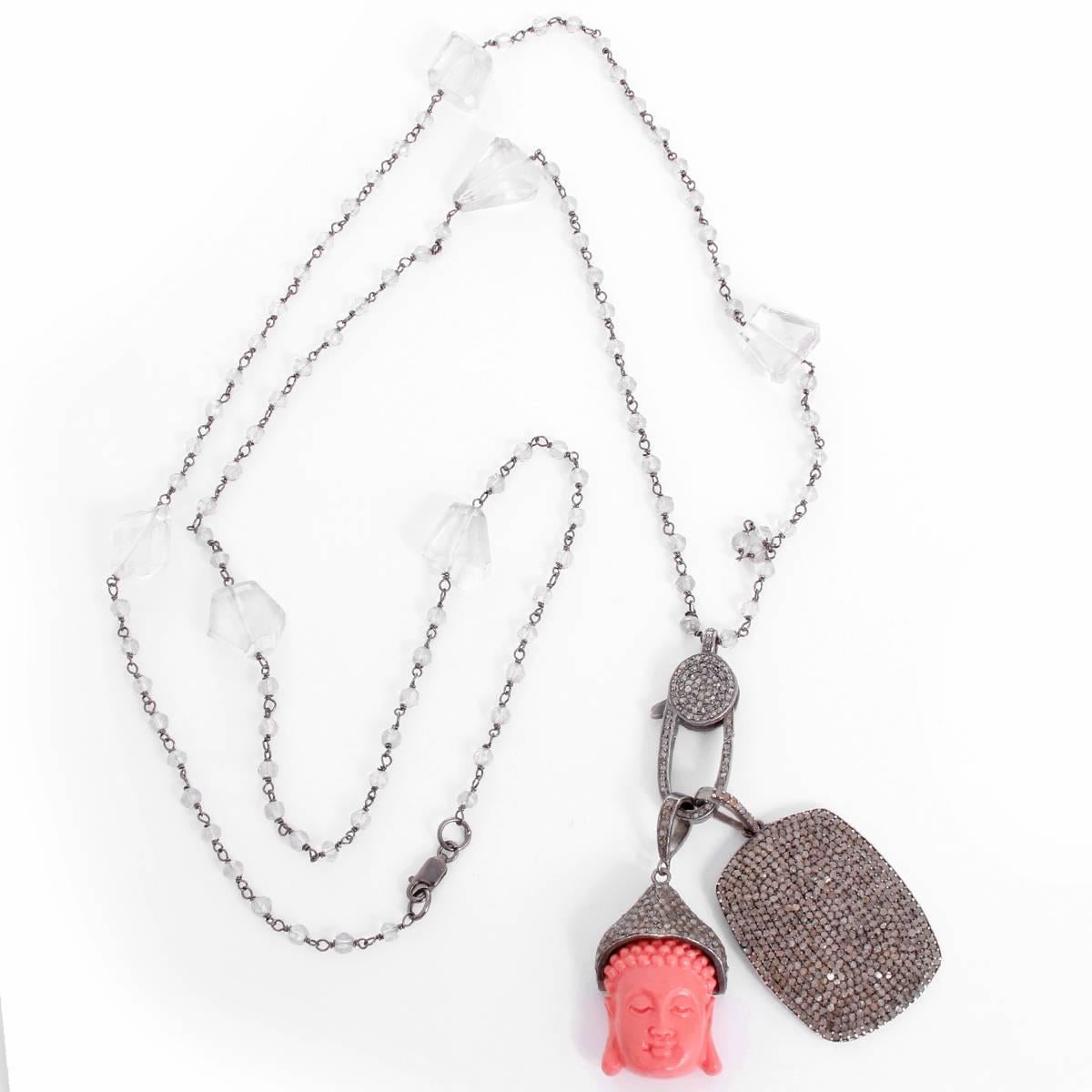 Clear Quartz, Diamond, Coral Buddha and Dog Tag Pendant Necklace - . This necklace features a coral Buddha, dog tag pendant, and clasp; all with diamonds set in silver on a clear quartz chain. Pendants measure apx. 3-1/4 inches in length at the