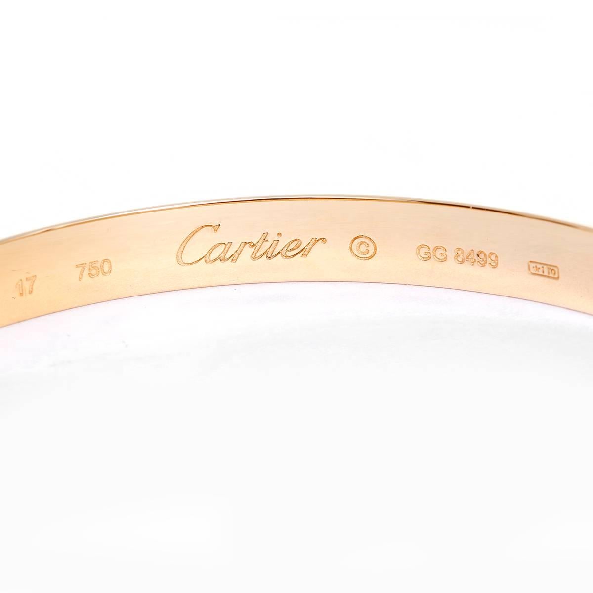 Cartier Love Bracelet 18k Yellow Gold Size 17 with Screwdriver - . This beautiful bracelet is stamped Cartier, 17, 750  and GG8499.  This is a great piece for everyday as well as dress. Authenticity guaranteed. Like new condition with no dings or