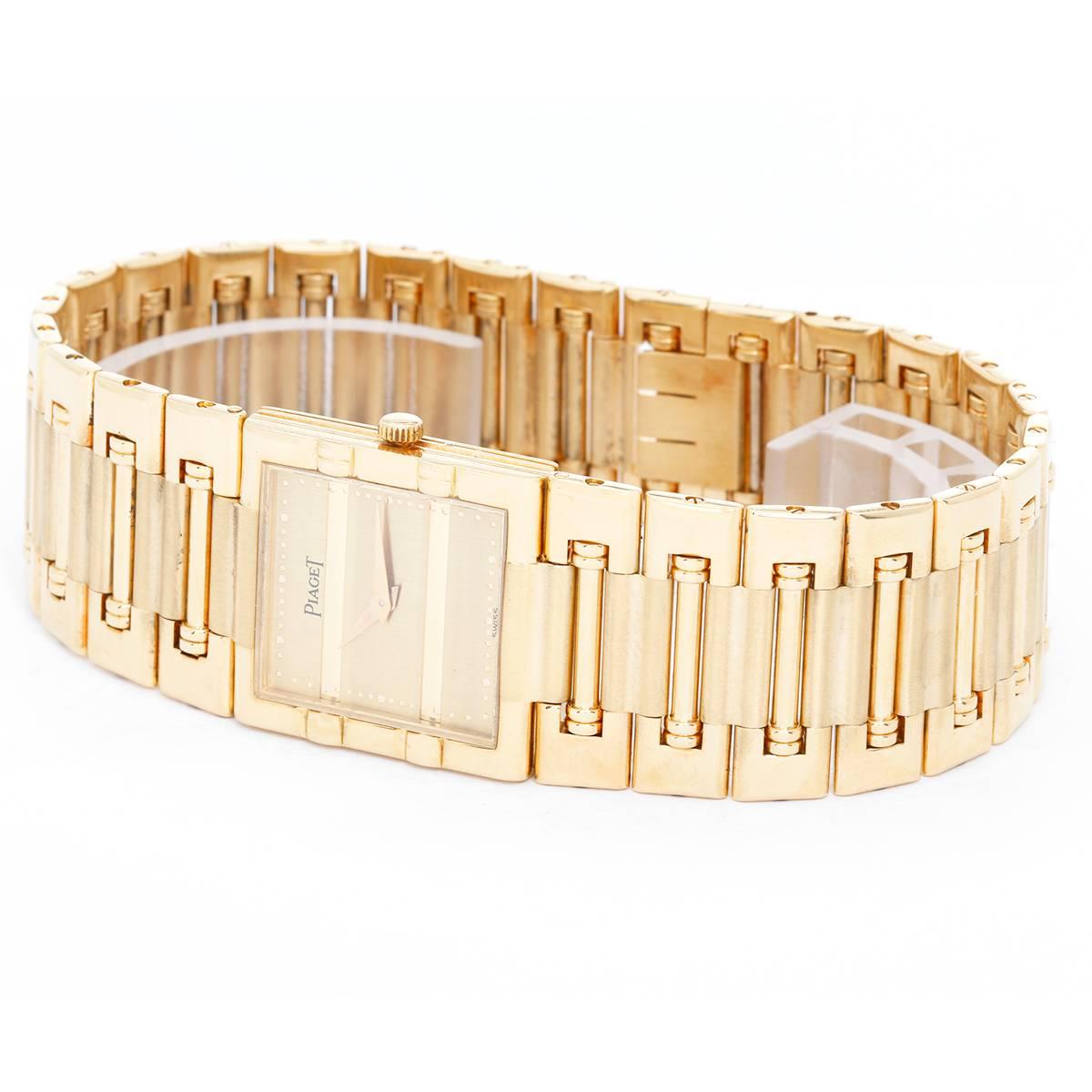 Piaget 18K Yellow Gold Dancer Men's Watch Ref. 80317 K81 -  Quartz. 18K Yellow Gold ( 23 mm ). Brushed champagne dial with dot minute divisions and gold hands. 18K link bracelet. Pre-owned with box. Will fit a 7-inch wrist