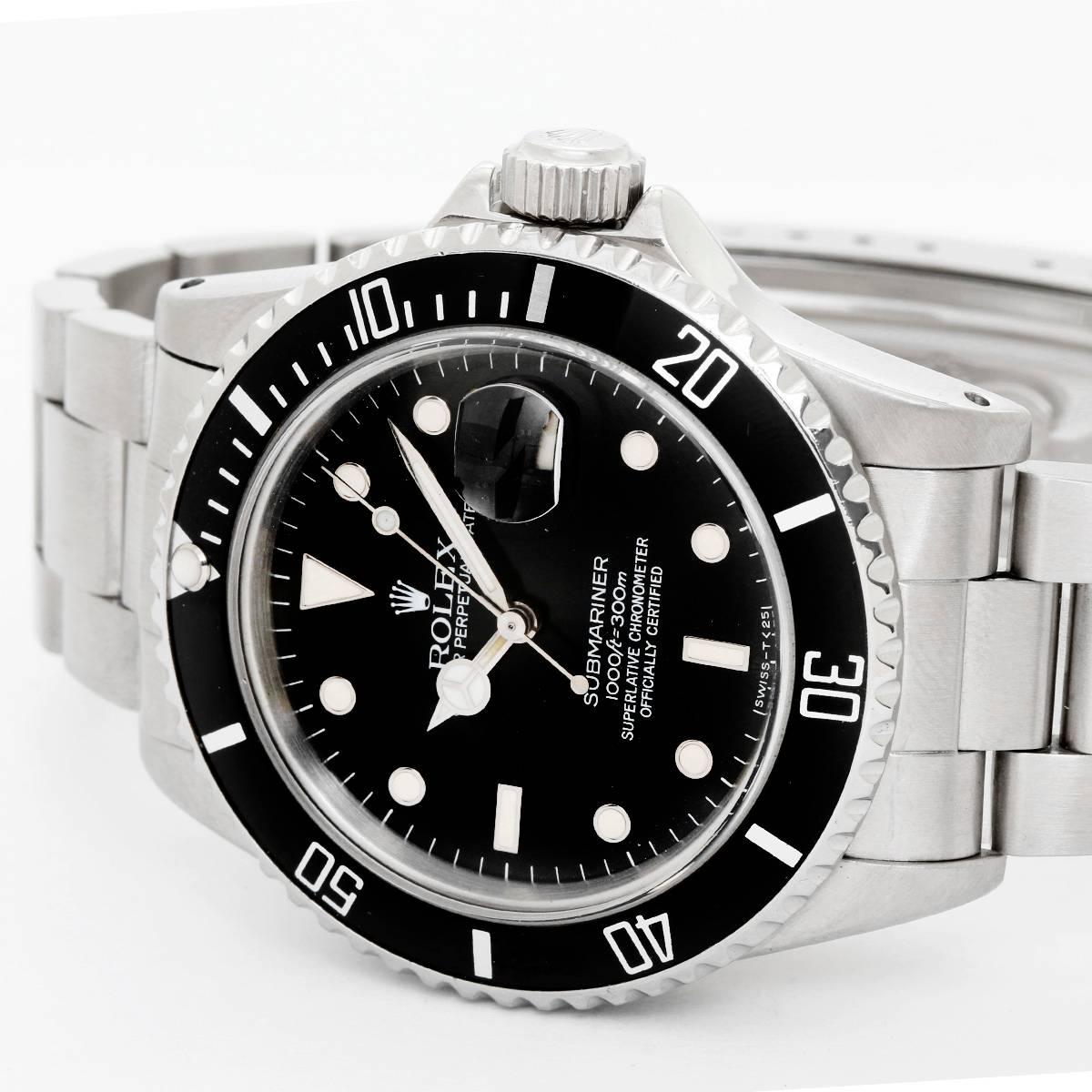 Rolex Submariner 16610 Stainless Steel Men's Diver Watch -  Automatic winding, 31 jewels, Quickset, sapphire crystal. Stainless steel case with rotating bezel with black insert  (40mm diameter). Black dial with luminous hour markers. Stainless steel
